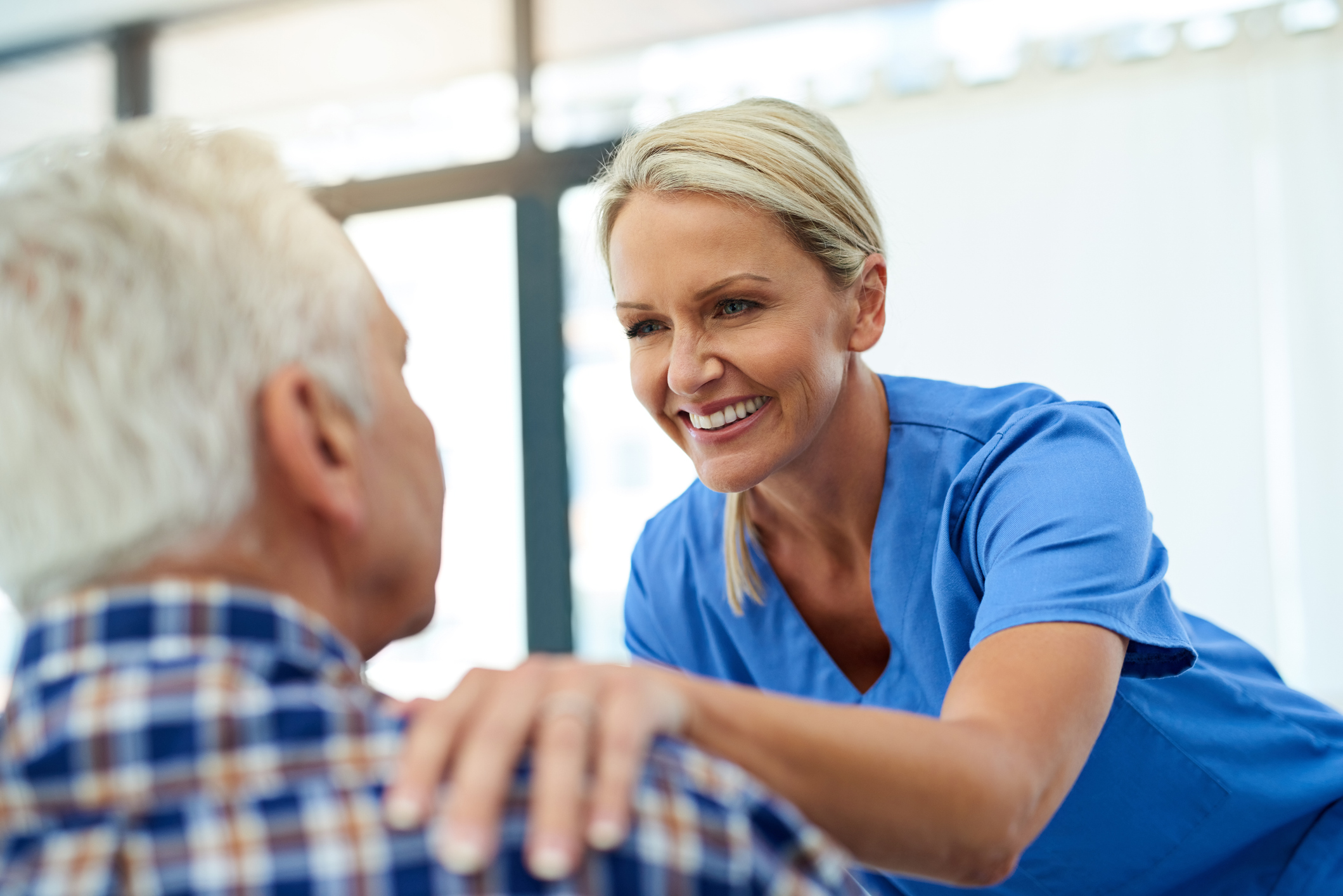 Shot of a friendly healthcare practitioner putting a comforting hand on her patient's shoulder